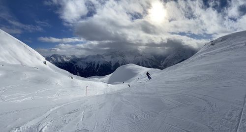 Scenic view of snowcapped mountains against sky