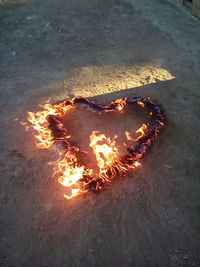 High angle view of bonfire at night