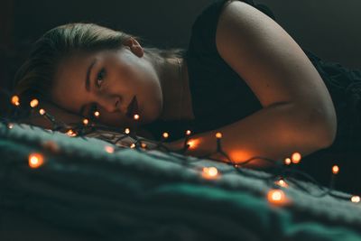 Close-up portrait of a girl lying down
