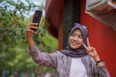 Young woman using mobile phone