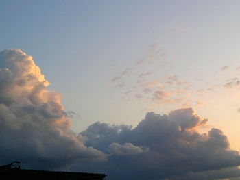 Low angle view of silhouette building against sky during sunset