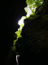 Scenic view of cave against sky