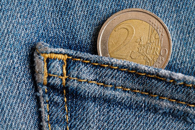 Close-up of coin in back pocket of jeans