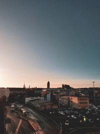 High angle view of buildings against clear sky during sunset