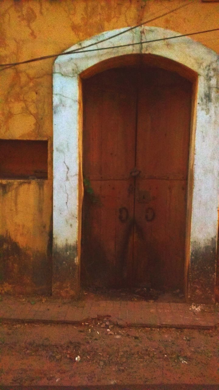 CLOSE-UP OF CLOSED DOOR OF BUILT STRUCTURE