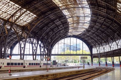 Railroad station platform seen through train window