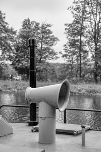 Close-up of pipe against wall in park