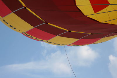 Low angle view of balloons against sky