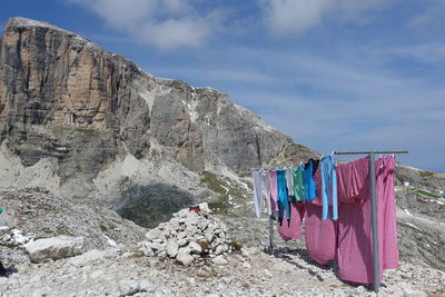 Clothes drying on rock against sky