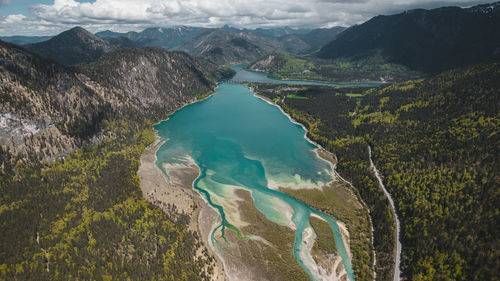 High angle view of lake amidst mountains