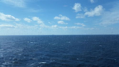 Scenic view of sea against blue sky