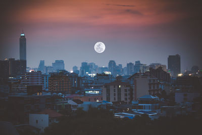 Cityscape against sky during sunset