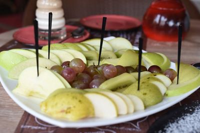 High angle view of fruits in plate on table