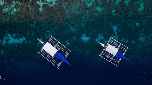 High angle view of wind turbines in sea