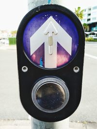 Close-up of road sign on street