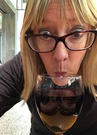 Portrait of young woman drinking glass