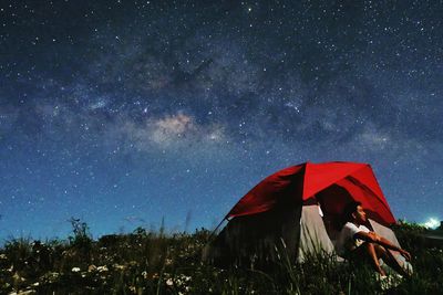 Tent against star field at night