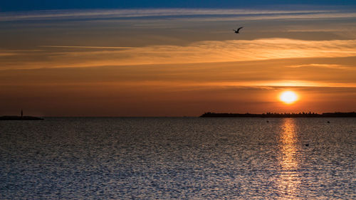 Scenic view of sea against sky during sunset