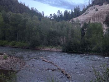 Scenic view of river and mountains