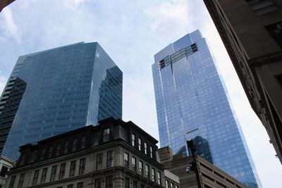 Low angle view of modern buildings against sky