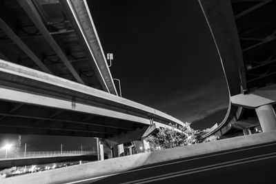 Low angle view of elevated road at night