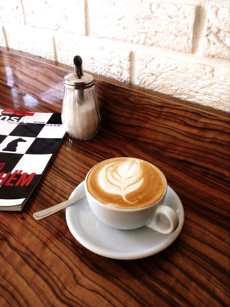 coffee, coffee - drink, coffee cup, cup, food and drink, drink, mug, table, still life, refreshment, frothy drink, froth art, cappuccino, hot drink, crockery, freshness, kitchen utensil, indoors, wood - material, saucer, no people, latte, froth, tray