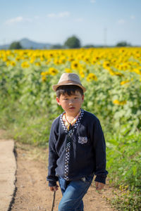 Boy standing on field