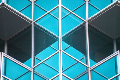 Low angle view of building seen through window