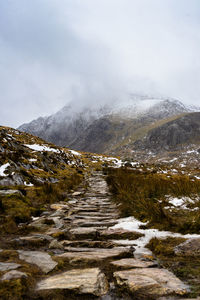 Scenic view of mountains against sky during winter