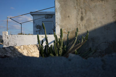 Close-up of retaining wall against sky