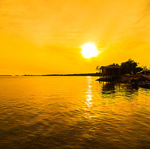 Scenic view of sunset over river