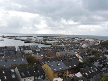 High angle view of city against cloudy sky