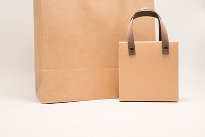 Close-up of shopping bag against white background