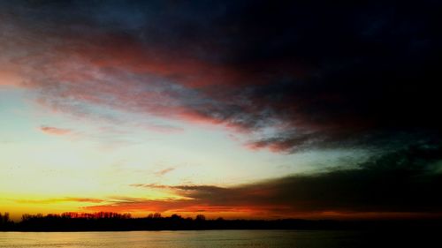 Scenic view of dramatic sky during sunset