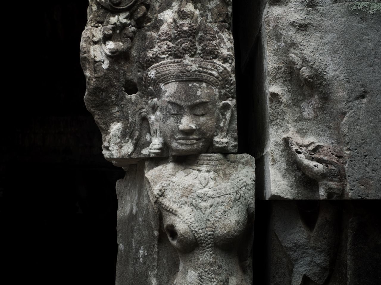 CLOSE-UP OF BUDDHA STATUE BY TEMPLE