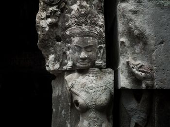 Close-up of statue against temple