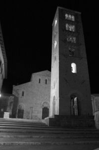 Low angle view of old building against sky at night