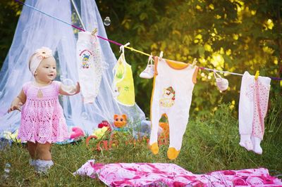 Baby girl catching bubbles