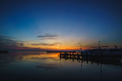 Scenic view of lake against sky during sunset