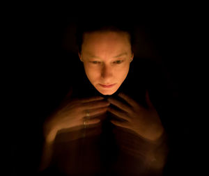 Portrait of boy in darkroom