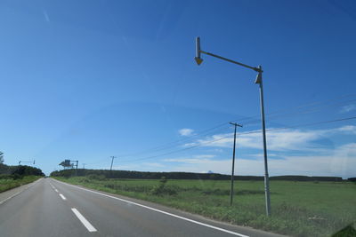 Road by street against sky