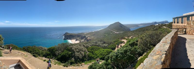 Panoramic shot of sea against clear blue sky