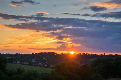 Scenic view of landscape at sunset