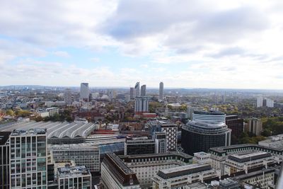 High angle view of modern buildings in city against sky