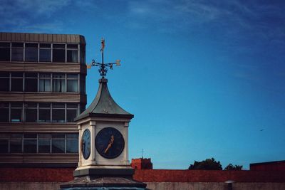 Low angle view of building against blue sky