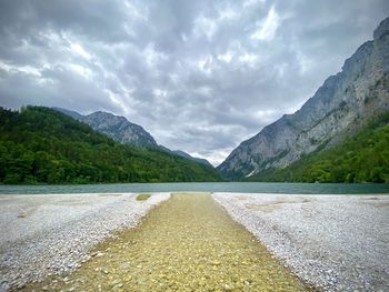 Scenic view of lake and mountains against sky