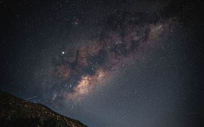 Low angle view of stars in sky at night