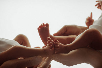 Low section of child lying on floor