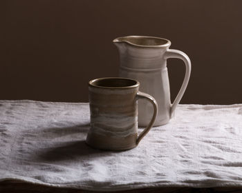 Close-up of coffee cup on table