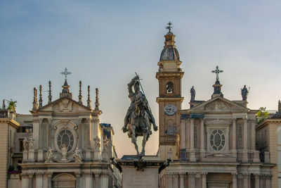 Low angle view of statue of building against sky